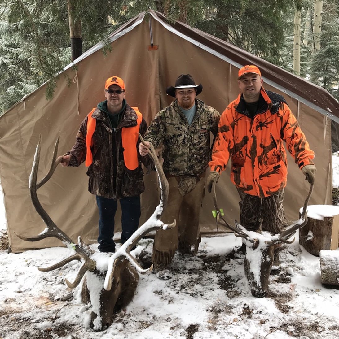 Big Game Hunts Unit 65 men with elk trophy